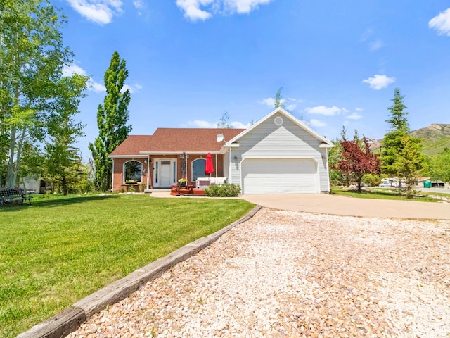 3677 N Willowbrook Ln, Eden, UT 84310 - single story home featuring driveway, covered porch, an attached garage, brick siding, and a front lawn
