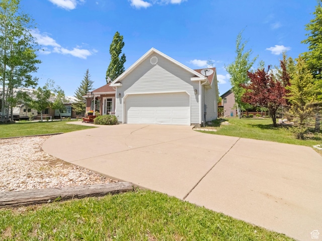 3677 N Willowbrook Ln, Eden, UT 84310 - view of front of house featuring a front lawn, an attached garage, and concrete driveway