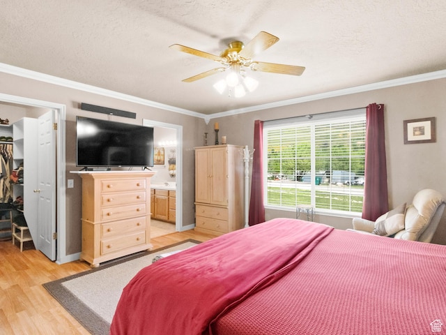 3677 N Willowbrook Ln, Eden, UT 84310 - bedroom featuring ornamental molding, light wood finished floors, a walk in closet, and connected bathroom