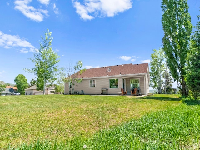 3677 N Willowbrook Ln, Eden, UT 84310 - rear view of house featuring a patio and a yard