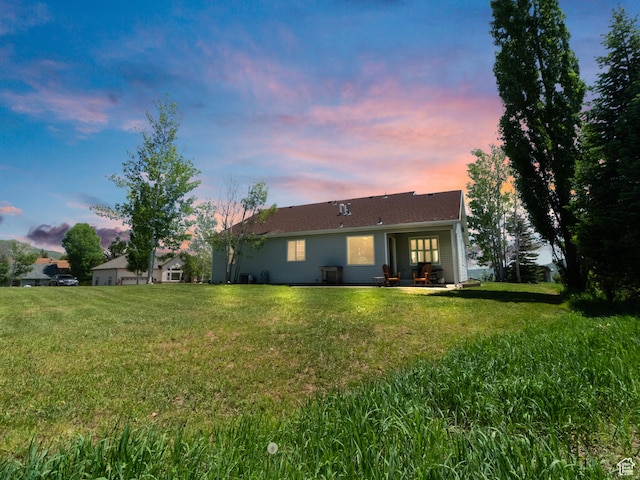 3677 N Willowbrook Ln, Eden, UT 84310 - rear view of house featuring a yard and a patio area