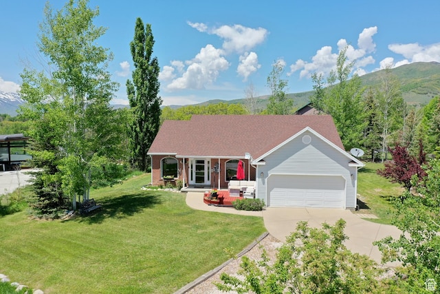 3677 N Willowbrook Ln, Eden, UT 84310 - ranch-style home featuring driveway, a front yard, a mountain view, and an attached garage