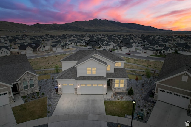 1368 E Clipper Peaks N, Eagle Mountain, UT 84005 - aerial view at dusk of a residential view and a mountain view