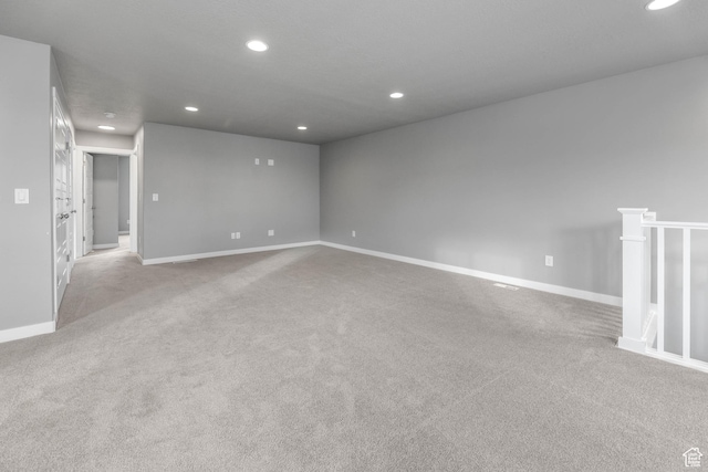 carpeted spare room with recessed lighting and baseboards