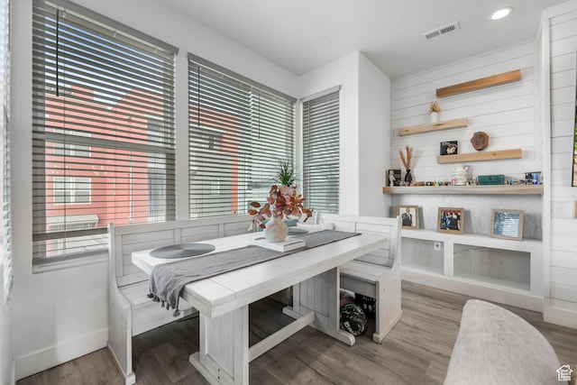dining space featuring baseboards, wood finished floors, plenty of natural light, breakfast area, and recessed lighting