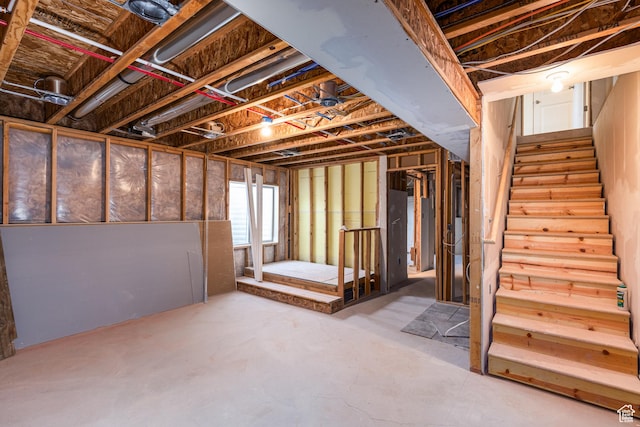 basement featuring stairs