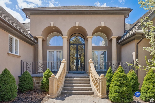 1714 Ridge Point Dr, Bountiful, UT 84010 - view of exterior entry featuring stucco siding and french doors