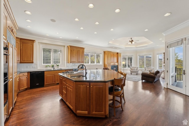 1714 Ridge Point Dr, Bountiful, UT 84010 - kitchen with black dishwasher, dark stone countertops, an island with sink, ornamental molding, and open floor plan