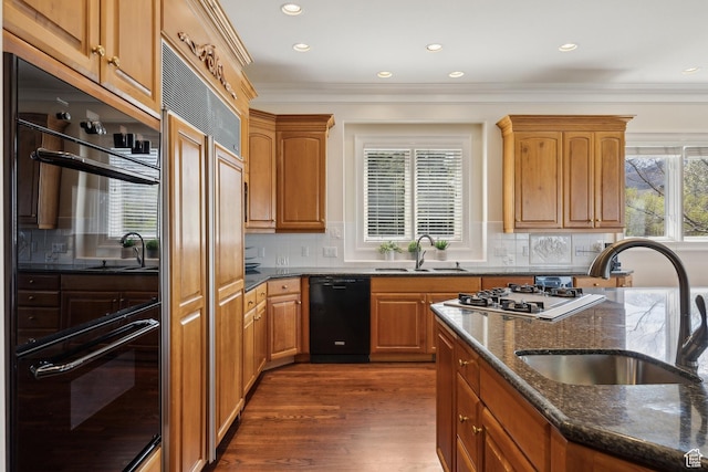 1714 Ridge Point Dr, Bountiful, UT 84010 - kitchen featuring black appliances, decorative backsplash, dark stone countertops, and a sink