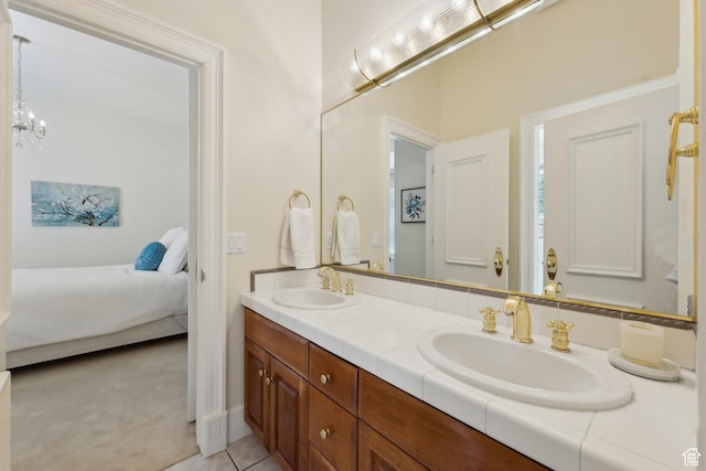 1714 Ridge Point Dr, Bountiful, UT 84010 - ensuite bathroom with double vanity, a notable chandelier, ensuite bath, and a sink