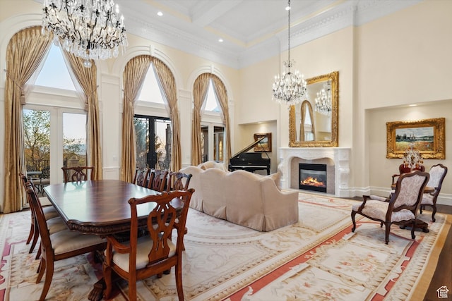 1714 Ridge Point Dr, Bountiful, UT 84010 - dining space with an inviting chandelier, ornamental molding, a high end fireplace, beam ceiling, and a high ceiling