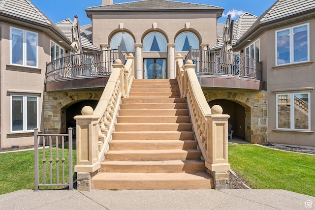 1714 Ridge Point Dr, Bountiful, UT 84010 - exterior space with stucco siding, stairs, a balcony, and stone siding