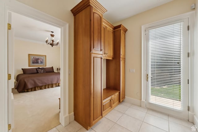 1714 Ridge Point Dr, Bountiful, UT 84010 - mudroom featuring a wealth of natural light, light tile patterned floors, a notable chandelier, and baseboards