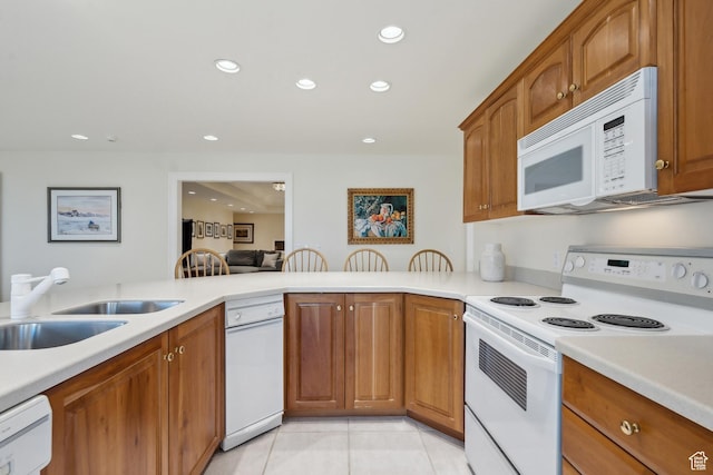 1714 Ridge Point Dr, Bountiful, UT 84010 - kitchen with light tile patterned floors, white appliances, recessed lighting, and light countertops