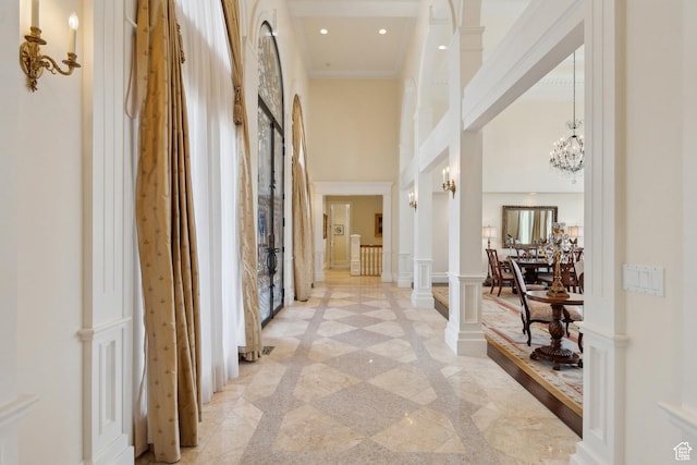 1714 Ridge Point Dr, Bountiful, UT 84010 - hall featuring a towering ceiling, a chandelier, recessed lighting, and crown molding