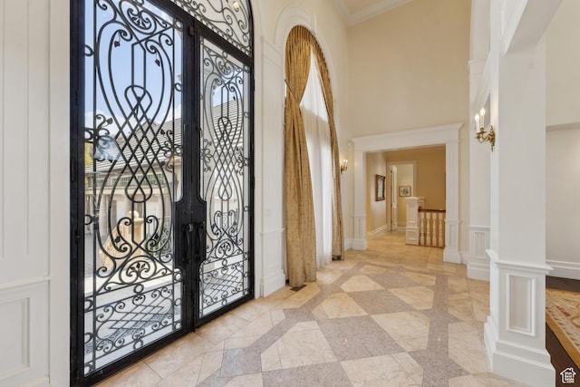 1714 Ridge Point Dr, Bountiful, UT 84010 - foyer with a decorative wall, ornamental molding, a towering ceiling, french doors, and wainscoting