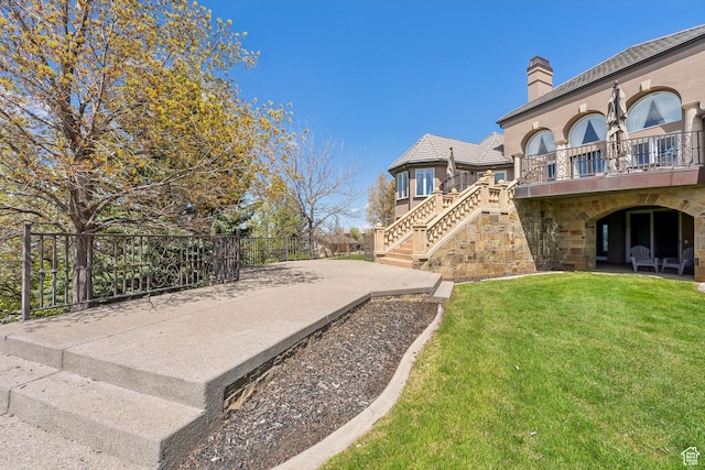 1714 Ridge Point Dr, Bountiful, UT 84010 - view of yard featuring fence, a patio area, stairs, and a balcony
