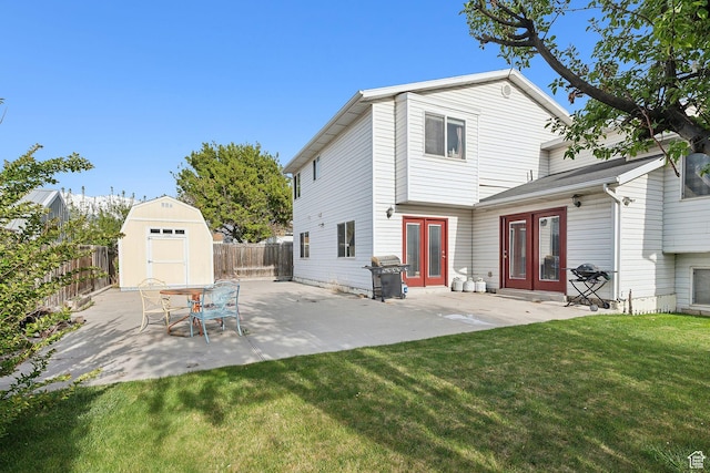 472 W 330 S, American Fork, UT 84003 - back of property with french doors, a fenced backyard, a shed, and a lawn