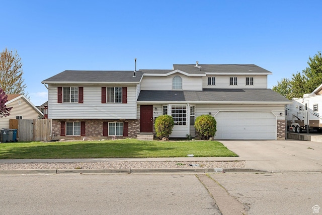 view of front of property featuring concrete driveway, a front yard, brick siding, and fence
