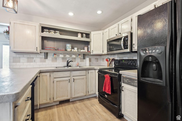 472 W 330 S, American Fork, UT 84003 - kitchen featuring black appliances, a sink, tasteful backsplash, and light countertops
