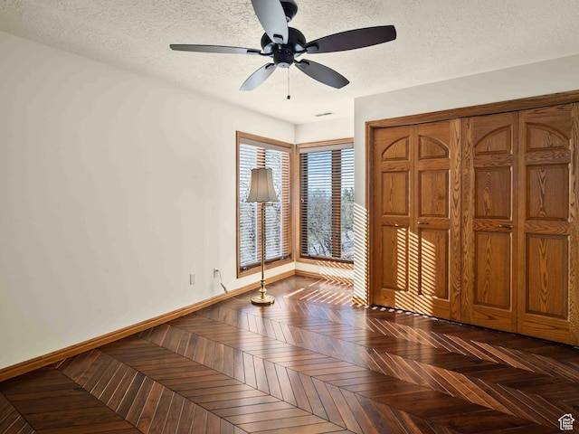 4120 S Beus Dr E, Ogden, UT 84403 - unfurnished bedroom featuring a textured ceiling, ceiling fan, and baseboards