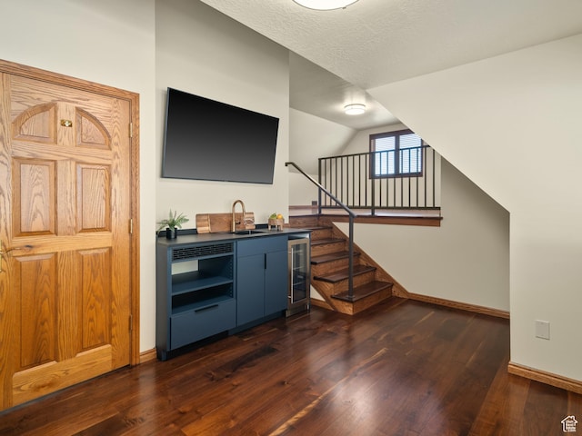4120 S Beus Dr E, Ogden, UT 84403 - bar with indoor wet bar, dark wood-style flooring, baseboards, lofted ceiling, and wine cooler