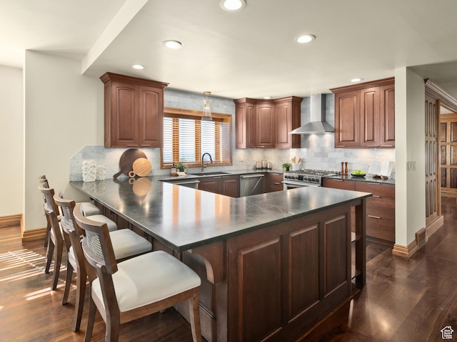 4120 S Beus Dr E, Ogden, UT 84403 - kitchen with a breakfast bar area, a sink, dark countertops, and wall chimney exhaust hood