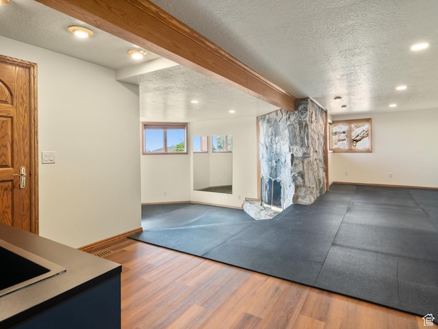 4120 S Beus Dr E, Ogden, UT 84403 - exercise room featuring baseboards, recessed lighting, wood finished floors, and a textured ceiling
