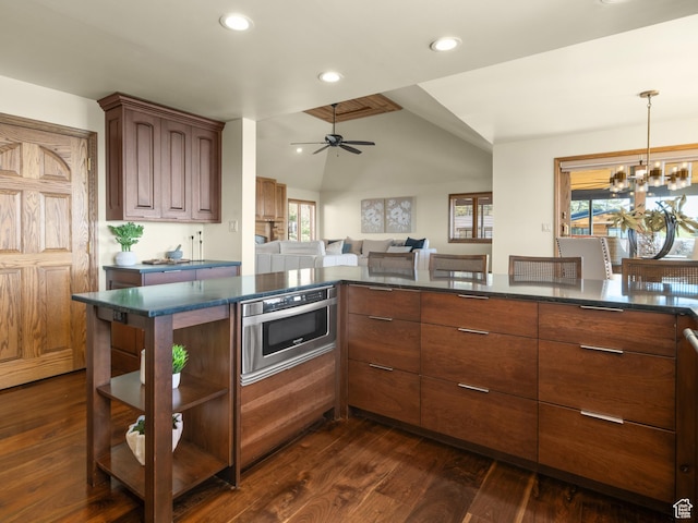 4120 S Beus Dr E, Ogden, UT 84403 - kitchen featuring open shelves, dark countertops, dark wood-style floors, open floor plan, and ceiling fan with notable chandelier