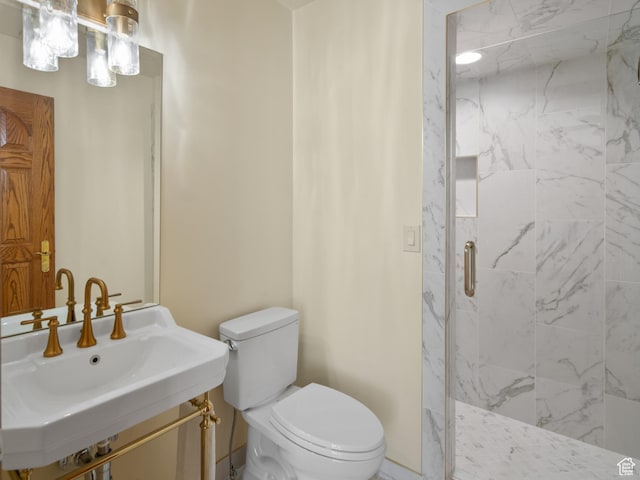 4120 S Beus Dr E, Ogden, UT 84403 - bathroom featuring a sink, toilet, and a marble finish shower
