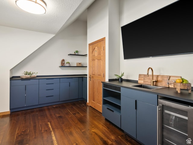 4120 S Beus Dr E, Ogden, UT 84403 - bar with a textured ceiling, a sink, dark wood-style flooring, vaulted ceiling, and wine cooler