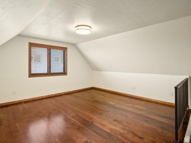 4120 S Beus Dr E, Ogden, UT 84403 - bonus room with baseboards, wood finished floors, and lofted ceiling