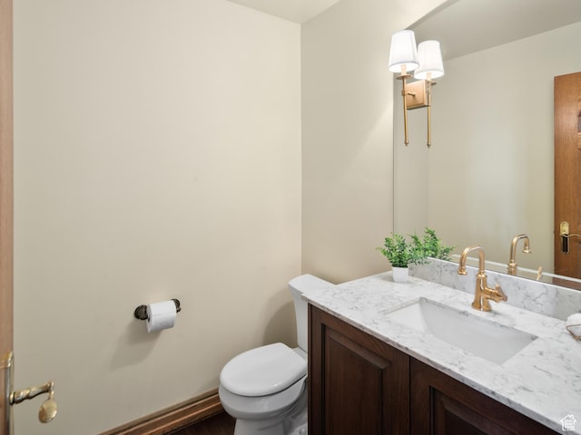 4120 S Beus Dr E, Ogden, UT 84403 - half bathroom featuring toilet and vanity