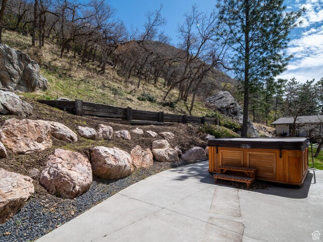 4120 S Beus Dr E, Ogden, UT 84403 - view of patio featuring a mountain view and a hot tub