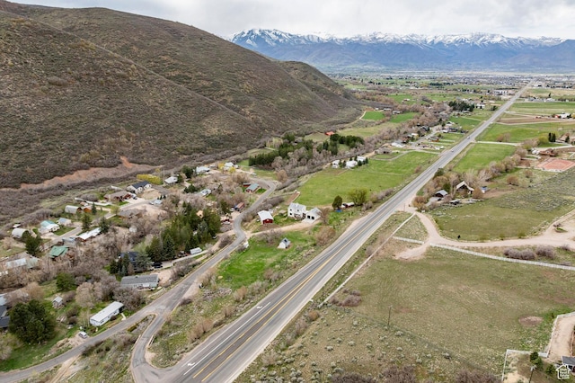 birds eye view of property with a mountain view