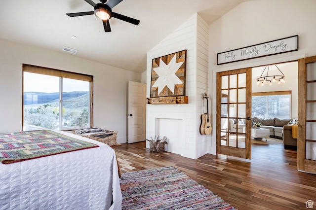 bedroom with french doors, visible vents, wood finished floors, high vaulted ceiling, and a notable chandelier