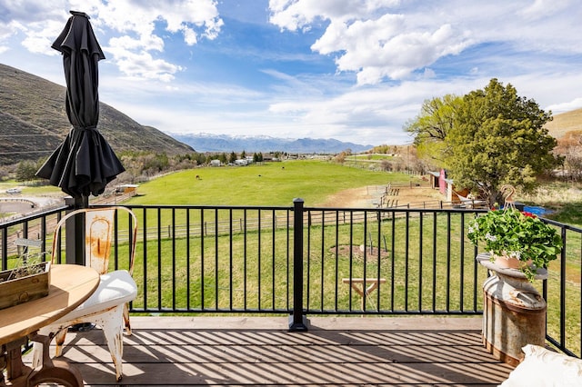 balcony with a rural view and a mountain view