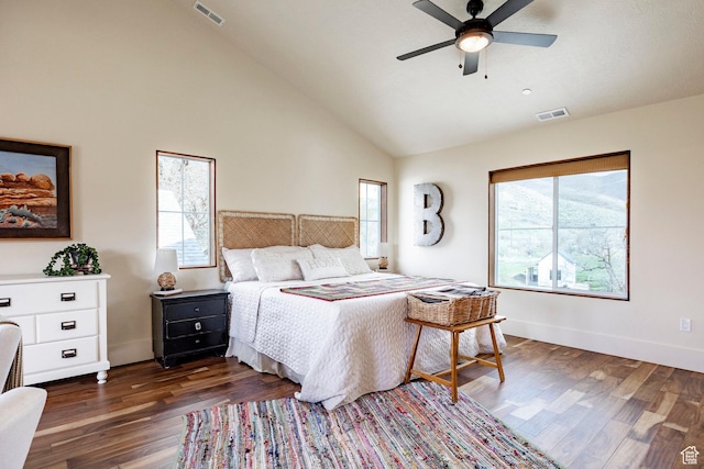 bedroom featuring high vaulted ceiling, visible vents, and multiple windows