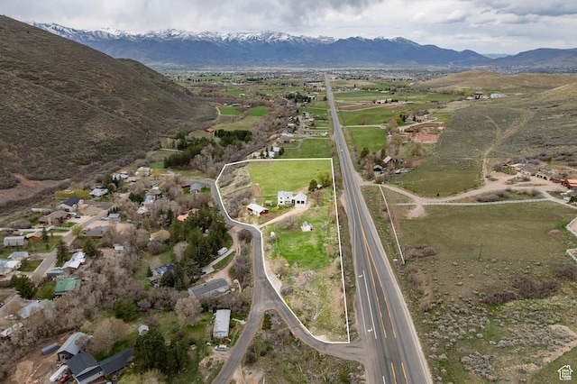 drone / aerial view featuring a rural view and a mountain view