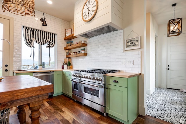 kitchen featuring green cabinetry, dark wood finished floors, stainless steel appliances, decorative backsplash, and custom exhaust hood