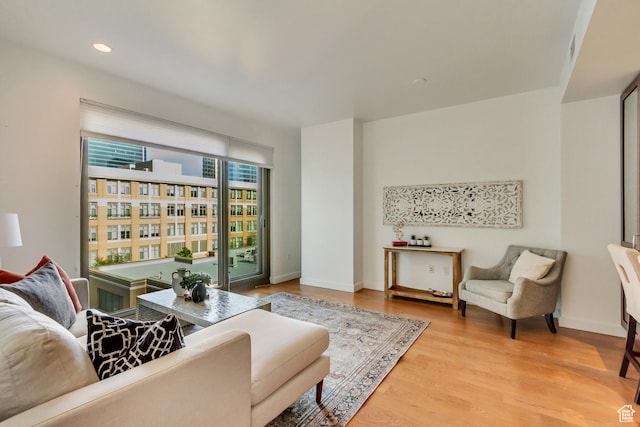 45 W S Temple St Unit 701, Salt Lake City, UT 84101 - living area with recessed lighting, wood finished floors, and baseboards
