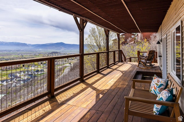 wooden terrace featuring a mountain view