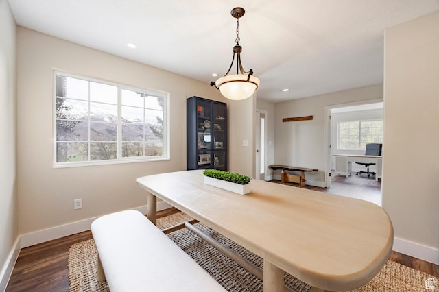 dining space with recessed lighting, wood finished floors, and baseboards