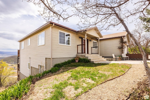 single story home with a patio and fence