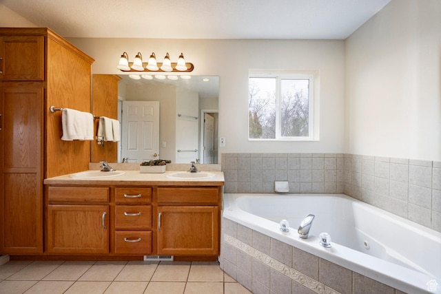 full bath with a jetted tub, visible vents, tile patterned flooring, and a sink