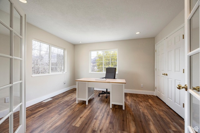 office space with a textured ceiling, visible vents, baseboards, dark wood-style flooring, and recessed lighting