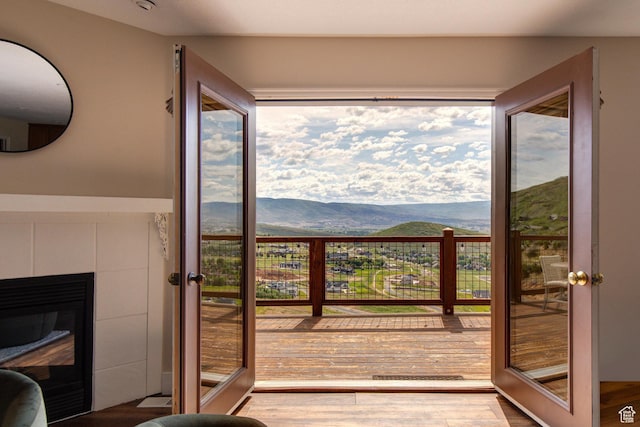 391 Bern Dr, Midway, UT 84049 - doorway featuring a mountain view, french doors, wood finished floors, and a fireplace