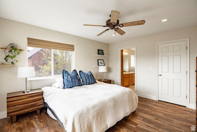bedroom featuring recessed lighting, ensuite bathroom, wood finished floors, and baseboards