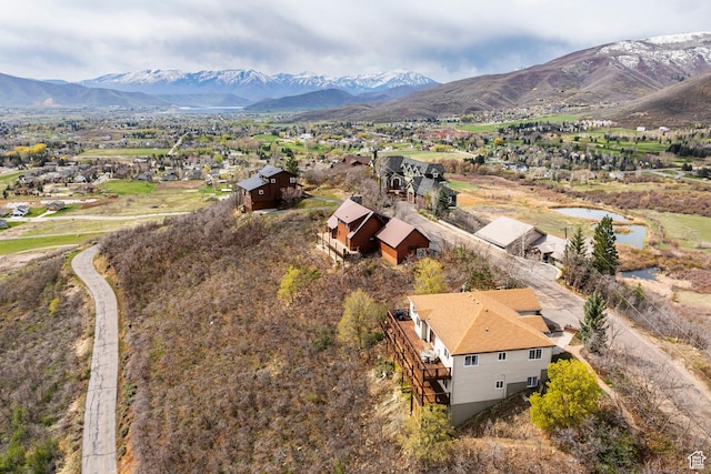 birds eye view of property with a residential view and a water and mountain view