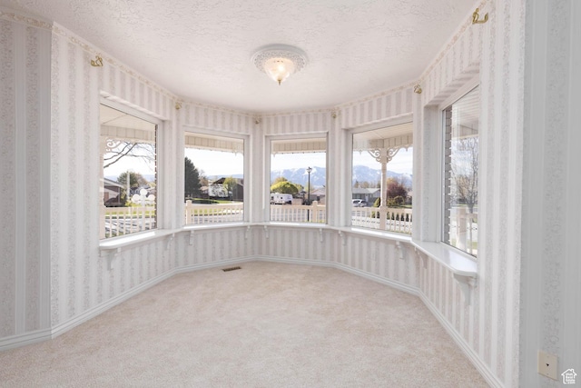 889 Upland Dr, Richfield, UT 84701 - interior space with visible vents, wallpapered walls, a textured ceiling, and carpet